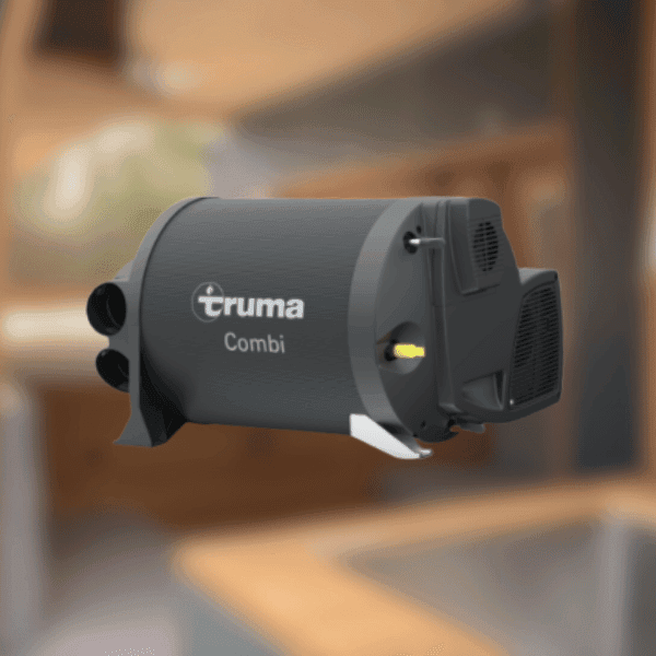 Chauffage Cylindrique Truma Combi Chauffage Truma Combi, forme cylindrique, sorties d'air, fond flou.
